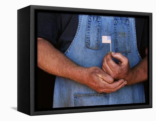 Man Holding Small American Flag-Bob Rowan-Framed Stretched Canvas
