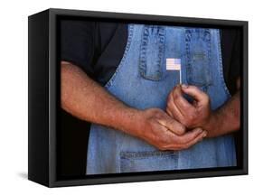 Man Holding Small American Flag-Bob Rowan-Framed Stretched Canvas