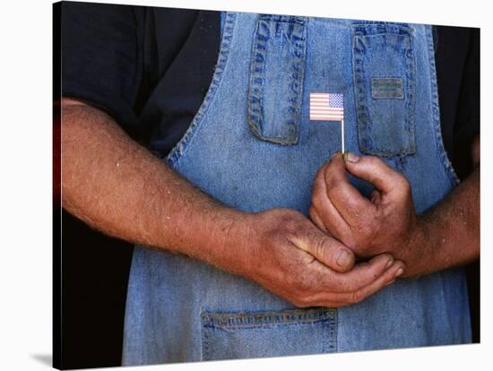 Man Holding Small American Flag-Bob Rowan-Stretched Canvas