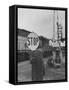 Man Holding Stop Sign by Hand While Automatic Gate Is Being Repaired-null-Framed Stretched Canvas