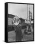 Man Holding Stop Sign by Hand While Automatic Gate Is Being Repaired-null-Framed Stretched Canvas