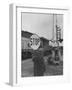 Man Holding Stop Sign by Hand While Automatic Gate Is Being Repaired-null-Framed Photographic Print