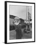 Man Holding Stop Sign by Hand While Automatic Gate Is Being Repaired-null-Framed Photographic Print