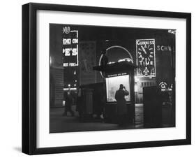 Man in a Raincoat Studies the Westminster City Guide Map at Night in Piccadilly Circus-null-Framed Photographic Print