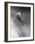 Man in a Vest in Mid-Air as He Skis Down a Steep Mountain-null-Framed Premium Photographic Print