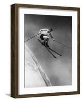 Man in a Vest in Mid-Air as He Skis Down a Steep Mountain-null-Framed Photographic Print