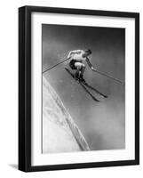 Man in a Vest in Mid-Air as He Skis Down a Steep Mountain-null-Framed Photographic Print