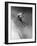Man in a Vest in Mid-Air as He Skis Down a Steep Mountain-null-Framed Photographic Print