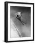 Man in a Vest in Mid-Air as He Skis Down a Steep Mountain-null-Framed Photographic Print