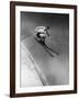 Man in a Vest in Mid-Air as He Skis Down a Steep Mountain-null-Framed Photographic Print