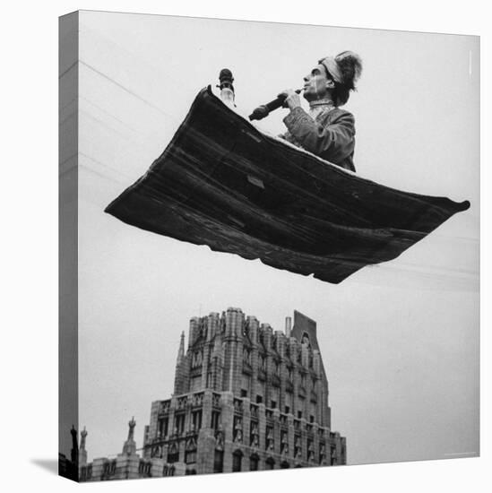 Man in Arabic Dress, Smoking a Water Cooled Pipe, is Comfortably Sitting on a Magic Carpet-Andreas Feininger-Stretched Canvas