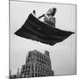 Man in Arabic Dress, Smoking a Water Cooled Pipe, is Comfortably Sitting on a Magic Carpet-Andreas Feininger-Mounted Photographic Print