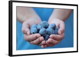 Man in Blue T-Shirt Holds Plum Fruits in His Palms-Joe Petersburger-Framed Photographic Print