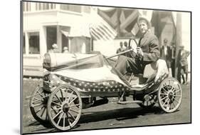 Man in Flag-Draped Mini-Car-null-Mounted Art Print