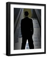 Man in Suit and Bowler Hat Standing in Front of Skyscraper-null-Framed Photographic Print