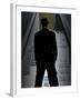 Man in Suit and Bowler Hat Standing in Front of Skyscraper-null-Framed Photographic Print