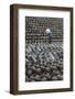 Man in the middle of big pile of wine jars stacked up at a local rice winery, Wuxi, China-Keren Su-Framed Photographic Print