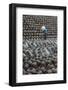 Man in the middle of big pile of wine jars stacked up at a local rice winery, Wuxi, China-Keren Su-Framed Photographic Print