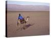 Man in Traditional Dress Riding Camel, Morocco-Merrill Images-Stretched Canvas