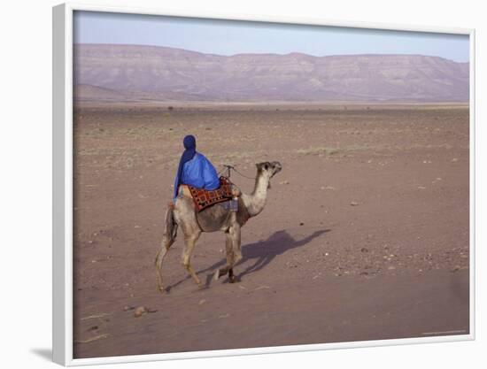 Man in Traditional Dress Riding Camel, Morocco-Merrill Images-Framed Photographic Print