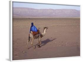 Man in Traditional Dress Riding Camel, Morocco-Merrill Images-Framed Photographic Print