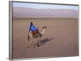 Man in Traditional Dress Riding Camel, Morocco-Merrill Images-Framed Photographic Print