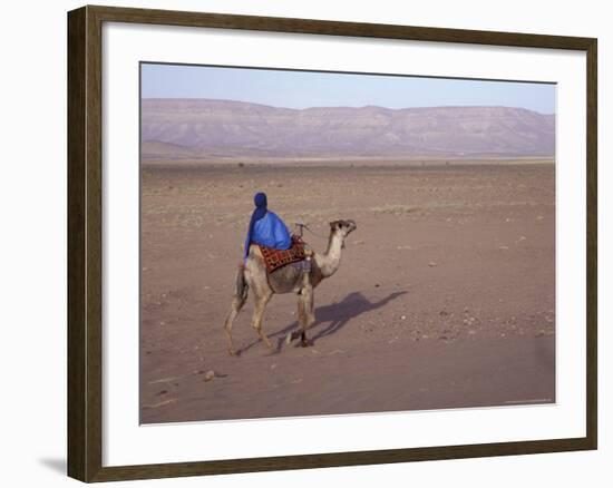 Man in Traditional Dress Riding Camel, Morocco-Merrill Images-Framed Photographic Print