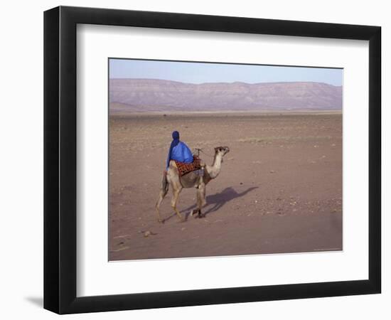 Man in Traditional Dress Riding Camel, Morocco-Merrill Images-Framed Photographic Print