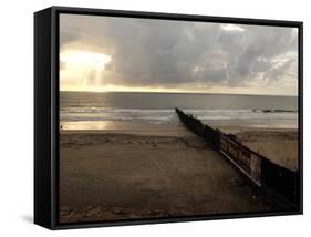 Man Jogs by the Beach Towards the Wall Dividing Mexico and the U.S. in Tijuana, Mexico-null-Framed Stretched Canvas