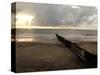 Man Jogs by the Beach Towards the Wall Dividing Mexico and the U.S. in Tijuana, Mexico-null-Stretched Canvas