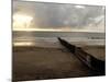 Man Jogs by the Beach Towards the Wall Dividing Mexico and the U.S. in Tijuana, Mexico-null-Mounted Photographic Print