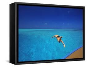 Man Jumping into Tropical Sea from Deck, Maldives, Indian Ocean-Papadopoulos Sakis-Framed Stretched Canvas