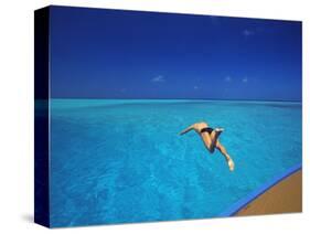 Man Jumping into Tropical Sea from Deck, Maldives, Indian Ocean-Papadopoulos Sakis-Stretched Canvas