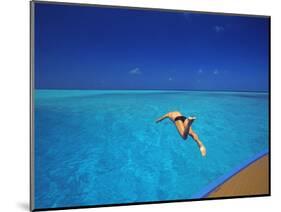 Man Jumping into Tropical Sea from Deck, Maldives, Indian Ocean-Papadopoulos Sakis-Mounted Photographic Print