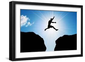 Man Jumping over Precipice between Two Rocky Mountains at Sun Light. Freedom, Risk, Challenge, Succ-Michal Bednarek-Framed Photographic Print