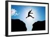 Man Jumping over Precipice between Two Rocky Mountains at Sun Light. Freedom, Risk, Challenge, Succ-Michal Bednarek-Framed Photographic Print