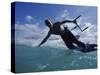 Man Kitesurfing on the Surface of Water-null-Stretched Canvas