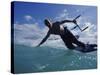 Man Kitesurfing on the Surface of Water-null-Stretched Canvas