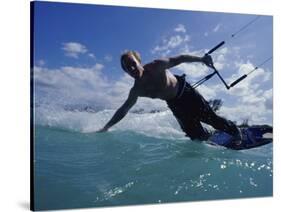 Man Kitesurfing on the Surface of Water-null-Stretched Canvas