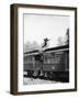 Man Leaping across the Roof of Railroad Cars-null-Framed Photo