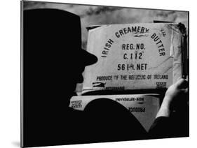 Man Loading Butter in Northern Ireland to Smuggle into Ireland-null-Mounted Photographic Print