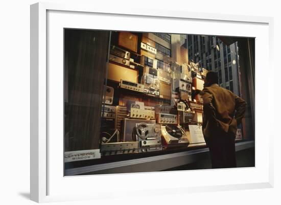 Man Looks at a Window Display of an Electronics Store, New York, New York, 1963-Yale Joel-Framed Photographic Print