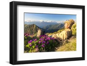 Man lying down on top of Monte Azzarini looks to Monte Disgrazia and Monte Pedena, Albaredo Valley-Roberto Moiola-Framed Photographic Print