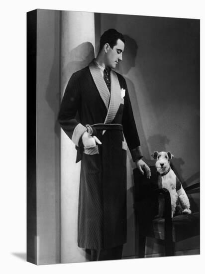 Man Models a Wool Jersey Dressing Gown and His Wire- Haired Fox Terrier Poses for the Camera-null-Stretched Canvas