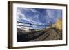 Man Mountain Biking on Countryside Path against Fence and Sky-Nosnibor137-Framed Photographic Print