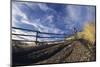 Man Mountain Biking on Countryside Path against Fence and Sky-Nosnibor137-Mounted Photographic Print