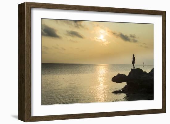 Man on a rock in backlight on the rocky west coast in Ouvea, Loyalty Islands, New Caledonia, Pacifi-Michael Runkel-Framed Photographic Print