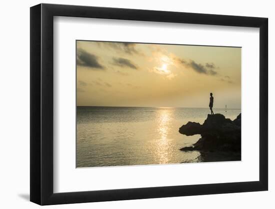 Man on a rock in backlight on the rocky west coast in Ouvea, Loyalty Islands, New Caledonia, Pacifi-Michael Runkel-Framed Photographic Print