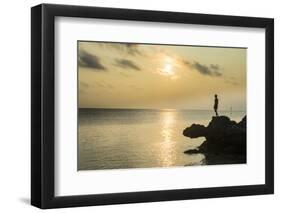 Man on a rock in backlight on the rocky west coast in Ouvea, Loyalty Islands, New Caledonia, Pacifi-Michael Runkel-Framed Photographic Print