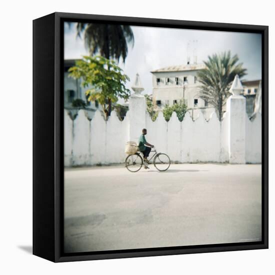 Man on Bicycle with Old Buildings Behind, Stone Town, Zanzibar, Tanzania, East Africa, Africa-Lee Frost-Framed Stretched Canvas